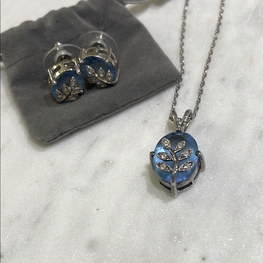 Avon Sterling Silver & Blue Topaz Necklace and earring set.